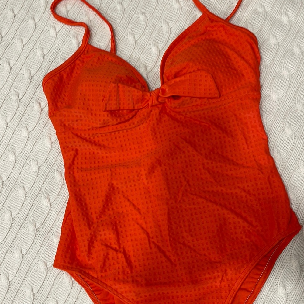 Body ID swimsuit one piece color is orange has bra cups. Size 10/12